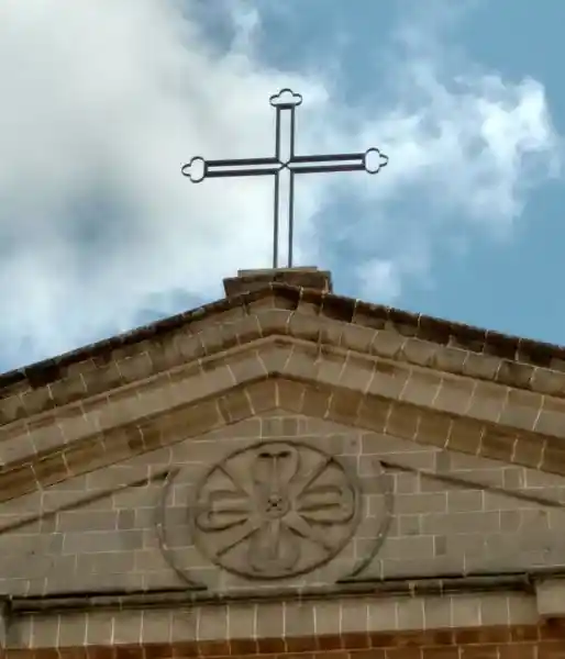 Christian cross and a solar cross on top of a church